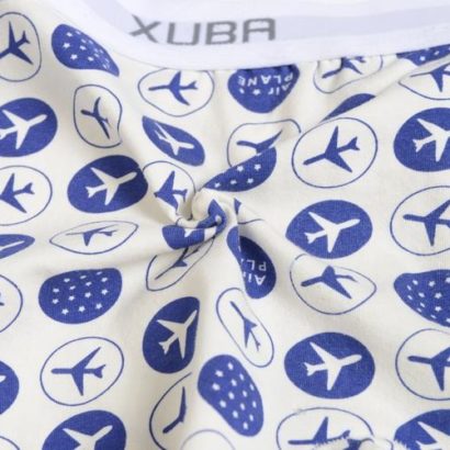 First Class white cotton boxer decorated with blue planes and stars and contains a grey belt