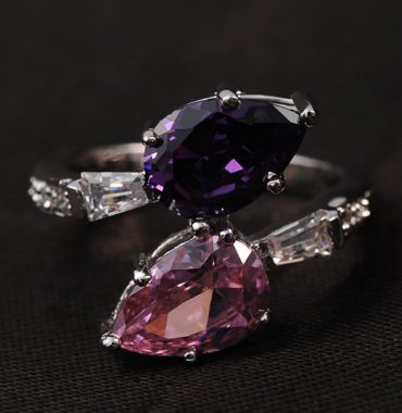 Special copper ring inlaid with white crystals and two big Violet and pink zircons