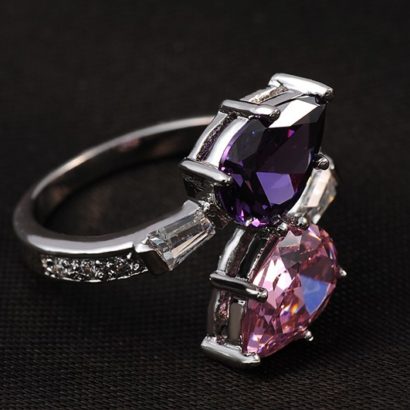 Special copper ring inlaid with white crystals and two big Violet and pink zircons