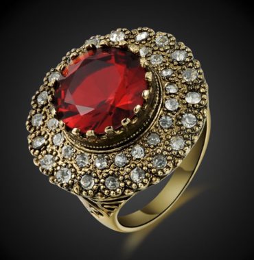 Copper ring three times of gold plating with a classical design and inlaid with red zircon
