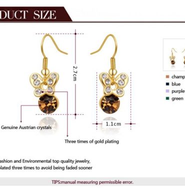 The butterfly earring is three times gold plated inlaid with genuine austrian white crystals and a champagne zircon